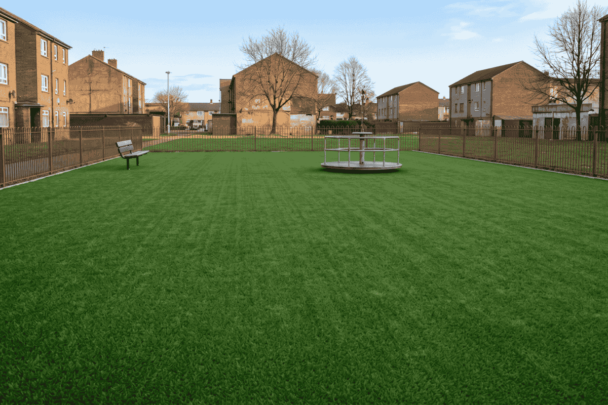 Freshly washed and sanitized artificial turf playground providing a safe, clean surface for kids.