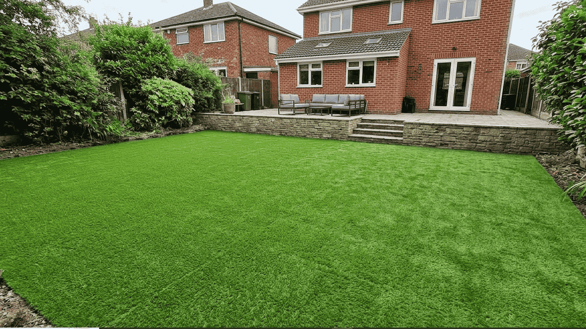A beautiful, clean residential backyard in Boca Raton featuring a newly installed artificial grass lawn.